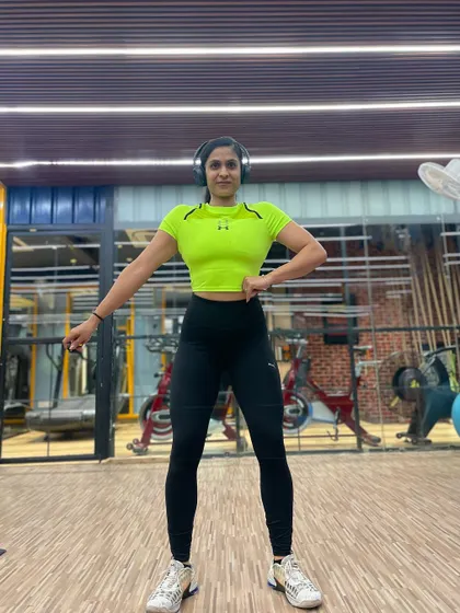 A confident front pose, ready to start a new week of training and coaching.