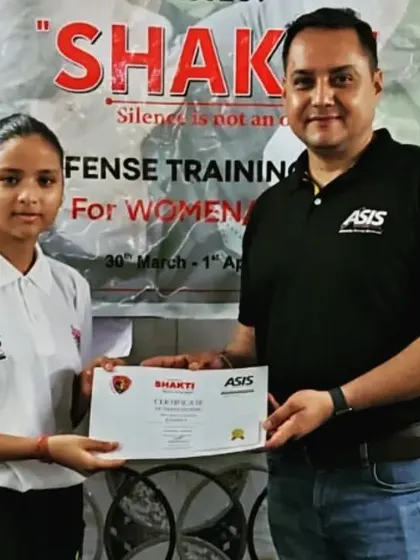 The smile of accomplishment. This certificate represents more than just training; it represents newfound strength and self-belief.