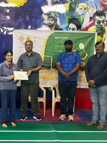 Ruthwa K. receiving her certificate at the Mini Olympics. These moments of recognition fuel the ambition for future competitions.
