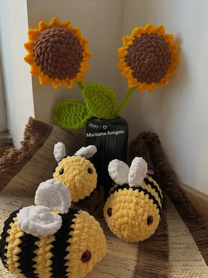 A group of our chunky yarn sunflowers and bumblebee toys. This combination is perfect for nature-themed decor and brings a touch of the garden indoors, forever.