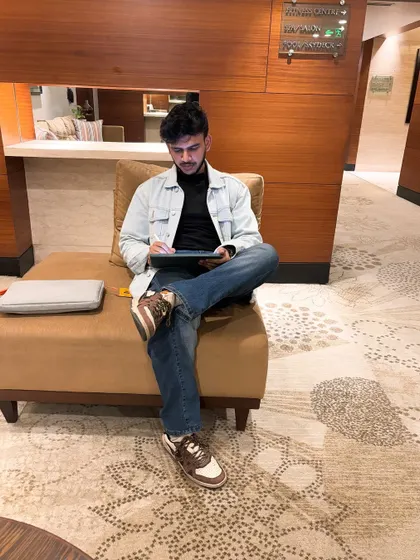 A candid shot of me working on the red eye drawing in a hotel lobby. Art can happen anywhere, and my iPad allows me to create detailed digital pieces on the go.