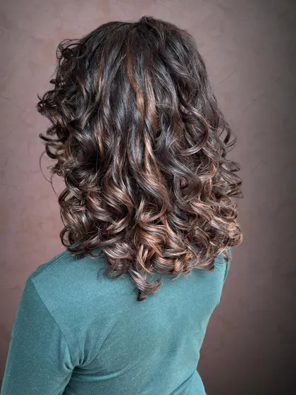 The highlights give her hair a sun-kissed glow.