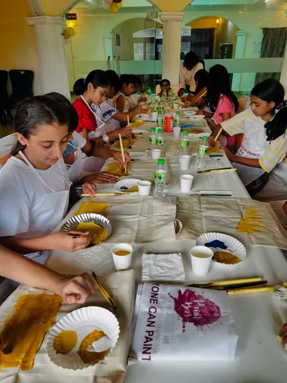 A group of kids getting creative at a tote bag painting workshop in Delhi. The room was filled with paint, giggles, and mini masterpieces.