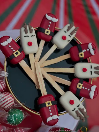 Our adorable Christmas cakesicles, shaped like Santa and his reindeer, are always a hit at holiday gatherings.