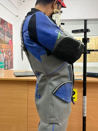 This side profile shows the correct standing posture for 10m Air Rifle. The stability of the body is the platform for a perfect shot, and we spend significant time perfecting this foundation.