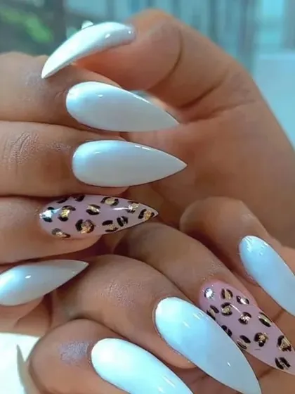 A different angle of the baby blue and leopard print stiletto nails, showing off the glossy finish.