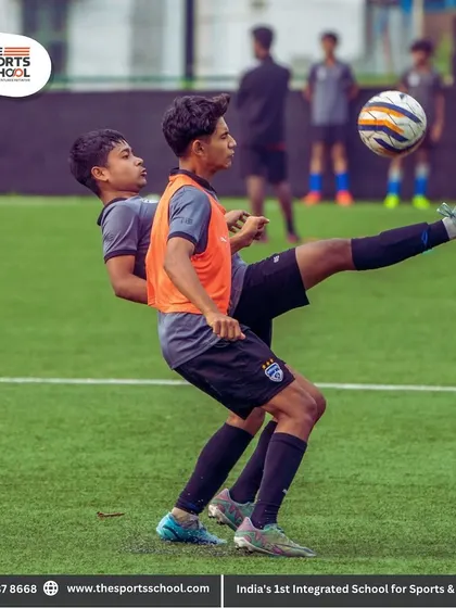 An athlete executes a high kick to control the ball, demonstrating the advanced technical skills honed during our daily training sessions.