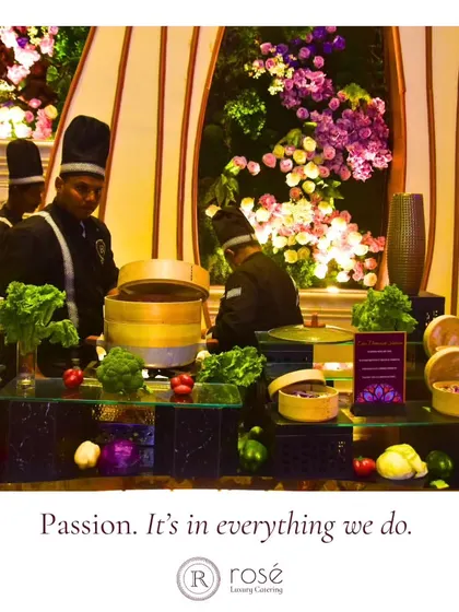 Our chefs at a live dim sum station, surrounded by fresh vegetables and bamboo steamers. This setup highlights our commitment to using fresh ingredients and preparing food live for your guests.