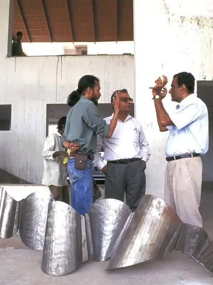 On-site discussions with artists and craftspeople are a critical part of our design process. This image captures a working session for the LMW Headquarters, where sculptural elements for the building were being reviewed and refined.