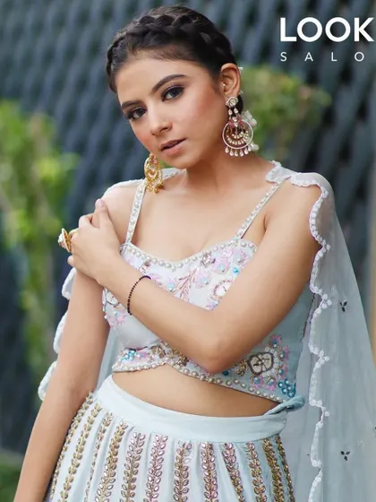 A confident pose showcasing our festive makeup artistry. The look is fresh and modern, perfect for a daytime Diwali event, with glowing skin and beautifully defined features.