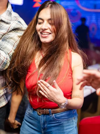 A candid shot of someone dancing with a huge smile. This is the kind of happiness I aim to inspire with my music at No Limmits.