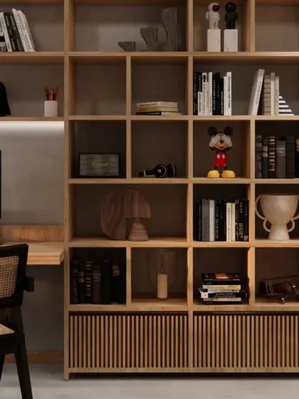 A close-up of the custom-built library shelving in HAUS 5, which provides a warm, intellectual counterpoint to the open, green terrace just beyond.