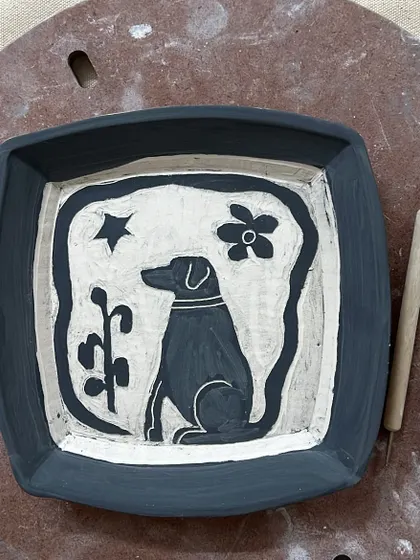 A custom plate immortalizing a beloved pet. These personal commissions are a joy to work on, turning memories and love into lasting ceramic art.