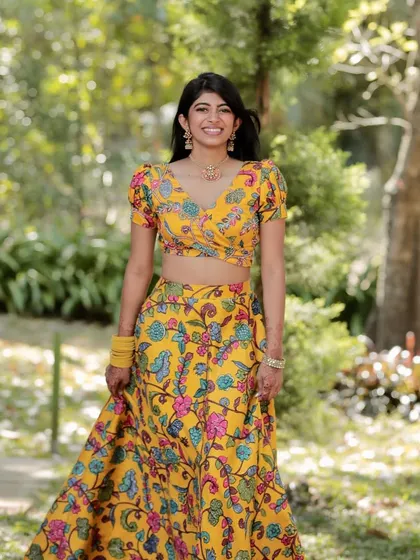 A smile that steals hearts. Our client looks radiant in this yellow floral lehenga set, paired with our handcrafted choker and jhumkas.