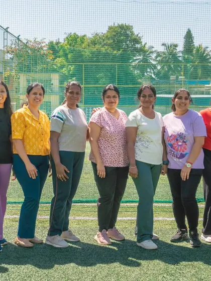 A group of mothers from our academy community posing for a photo at the Annual Rush Festival. Our events are for the whole family.