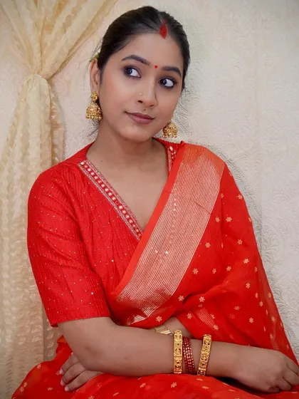 This look is close to my heart as I recreated a look from actress Nayanthara. I don't usually opt for red, but this simple red saree with a matching blouse and gold jhumkas felt so powerful and elegant.
