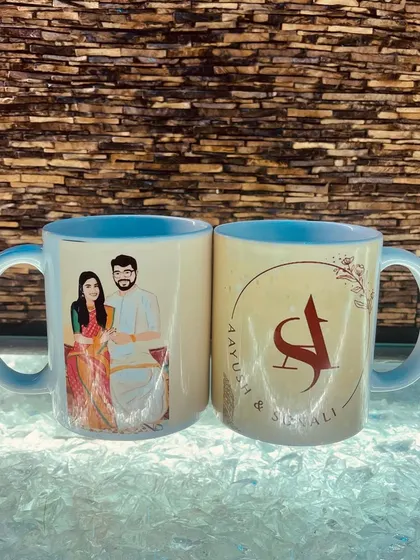 Here are the two custom mugs side-by-side, showcasing the full wrap-around design. The blue interior adds a nice pop of color to the mugs.