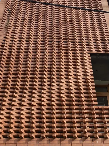 A duplicate image of the 'Brick Weave House' facade under construction.