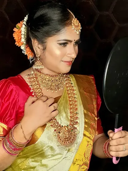 A candid moment of the bride admiring her final look. It is this moment of happiness and confidence that I strive to create for every single client. The makeup is set to be flawless from every angle.