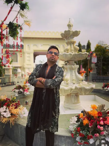 A moment of serious focus before the Baaraat madness begins. As the anchor, I'm the commander of this joyous army, ready to lead them into the celebration.