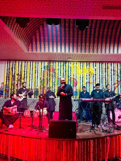 A full stage view of a performance with my band, Saaz-e-Mehfil. We bring a complete musical experience with multiple vocalists and instrumentalists for a rich sound.