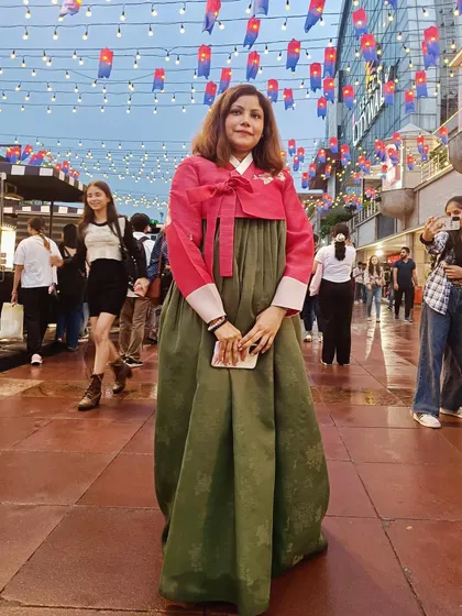 A full-length view of the beautiful Hanbok I wore. This highlights the traditional clothing, a major draw for attendees and a beautiful aspect of Korean culture that I love to share.