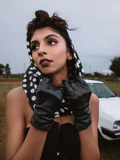 A portrait from the 'BLANCH' retro editorial. The styling, including the polka-dot headscarf and leather gloves, was meticulously chosen to capture the essence of classic mid-century fashion.