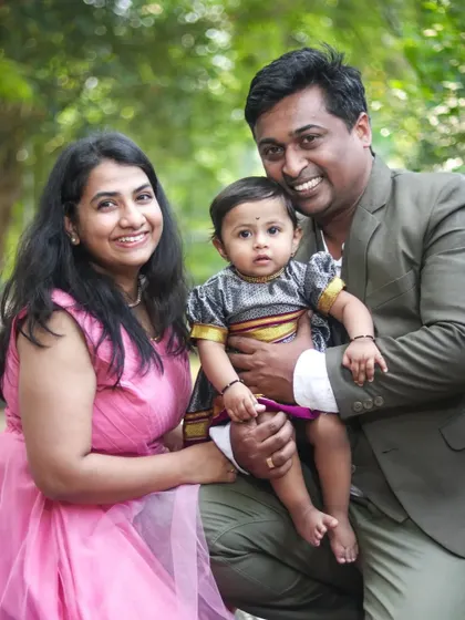 A classic family portrait taken in a lovely green park. My goal is to make everyone feel comfortable, resulting in natural smiles and a photo you'll cherish for years.