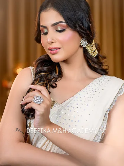 A close-up of the model, focusing on her soft curls and the beautiful hair accessory. The makeup is kept soft and neutral to balance the look.