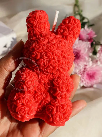 A close-up of the vibrant red Rose Bear candle. It's a must-have for a bold and romantic gift.
