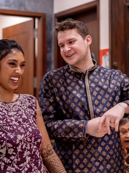 A sweet, candid moment between the couple during their Mehendi celebration.