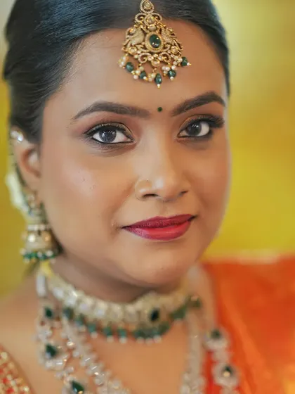 A beautiful portrait of the bride, showcasing the complete engagement makeup. The skin-like finish ensures she looks naturally radiant and not heavily made up.