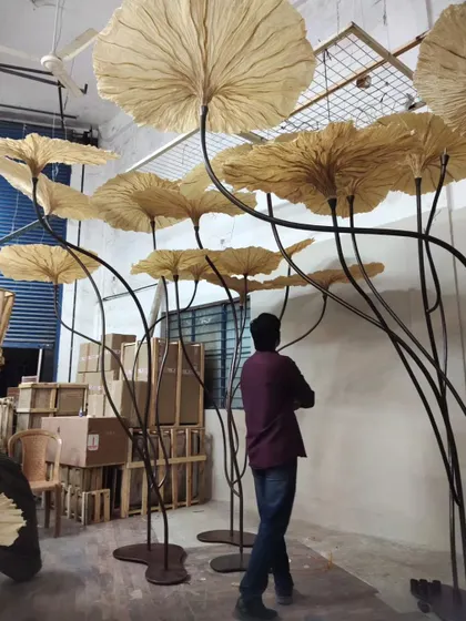 So much of our magic happens behind the scenes, in the workshop. Here, you can see the giant Victoria Lily-inspired lights taking shape before an exhibition. This hands-on process, from sketching to final assembly, is where we pour our hearts into every detail, ensuring each piece has a soul.