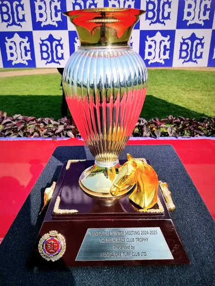 The Delhi Race Club Trophy, a beautiful silver vase with a golden horse head emblem.