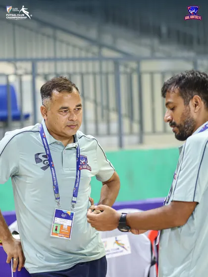 The brains behind the game. Our head coach and assistant coach discussing tactics.