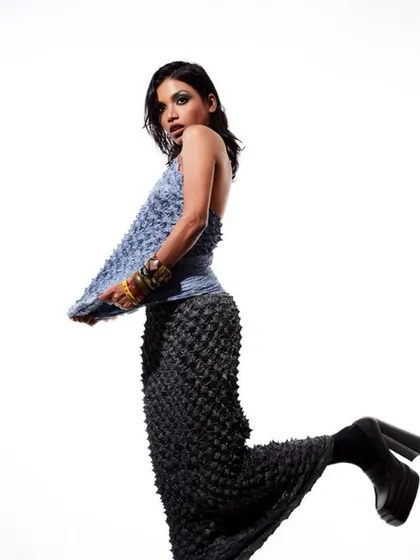 A full-body shot showing the wet-look hair in motion. This style is great for adding texture and a high-fashion edge to a photoshoot.
