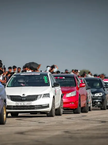 A long lineup of heavily modified cars ready to race. This showcases the depth of our participant pool and the serious level of competition at Vroom.