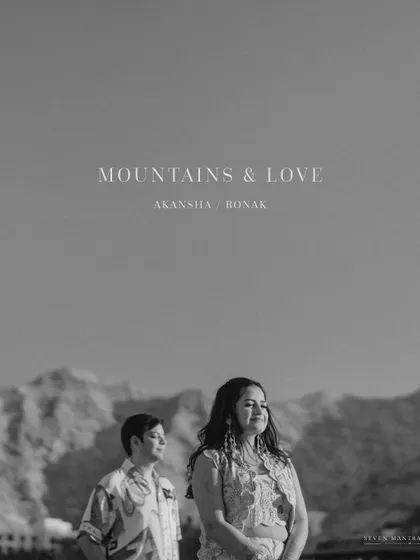 A moody and atmospheric black and white portrait with the title "Mountains & Love." This shot from Oman feels like a still from a classic film.