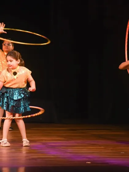 Our talented kids incorporating hula hoops into their dance routine. This performance was a creative blend of dance, skill, and colorful props that the audience loved.