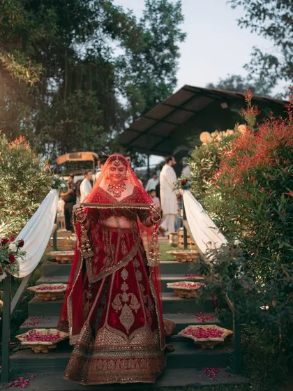 The bride's entry, framed by the lush greenery of Oleander Farms. The steps were adorned with flowers, creating a natural and beautiful aisle.