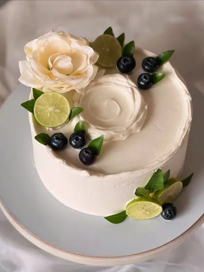 My most popular creation, the signature Italian Lemon & Blueberry cake. I offer many design variations, all featuring fresh blueberries, zesty lime, and smooth buttercream.