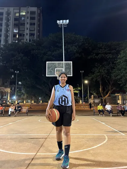 The captain of the Hoop Hustlers, a star player who leads her team with skill and determination.