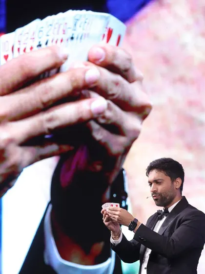 Performing a complex card manipulation on stage. The focus and precision required for these moments are something I work on constantly, all to create a perfect, seamless illusion.