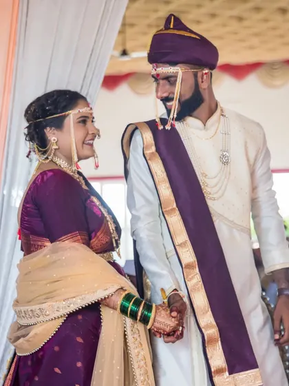 A candid moment of the couple sharing a look of love as they stand together after the ceremony.