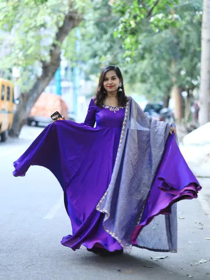A purple hand-embroidered Anarkali, a regal and elegant choice for any special occasion.