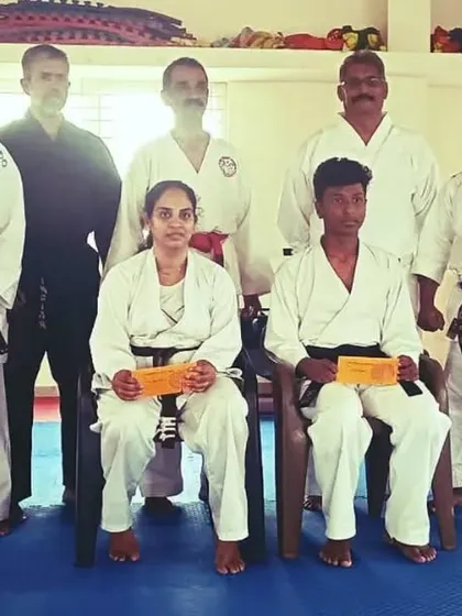 A group photo with senior instructors and winning students after the felicitation ceremony for their state and national achievements.