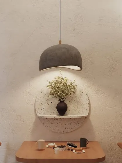 Even the smallest corners are an opportunity for design. We created this quiet little nook for two, featuring a custom terrazzo shelf and a minimalist dome pendant light that casts a warm, focused glow.