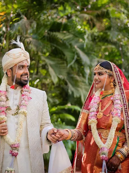 Holding on forever. Shreyas and Urmi take their first steps as husband and wife after their traditional Maharashtrian wedding.