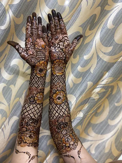 This is a detailed view of my intricate bridal henna work. Each design is unique, combining traditional patterns like paisleys and mandalas with fine-line fillers to create a stunning, full-coverage look for your special day.