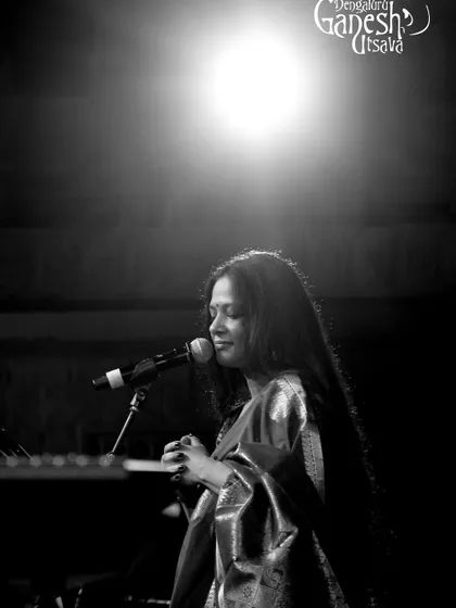 An artistic shot from the Bengaluru Ganesh Utsava. The single light feels like a spotlight on the music itself, a reminder of the focus and dedication that goes into every performance.